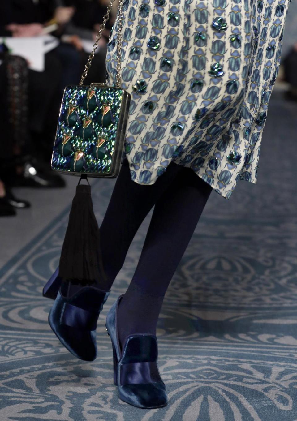 The Tory Burch Fall 2013 collection is modeled during Fashion Week in New York on Tuesday, Feb. 12, 2013. (AP Photo/Richard Drew)