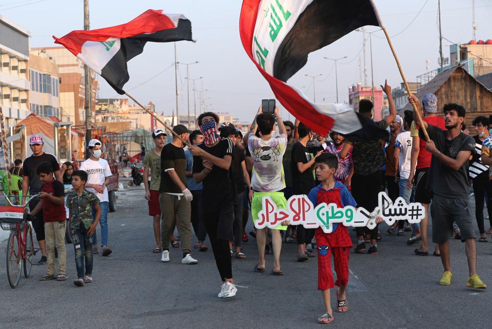 People demand electricity during a protest in Basra, Iraq, Monday, July. 27, 2020. As temperatures soar to record levels this summer, Iraq's power supply falls short of demand again, providing a spark for renewed anti-government protests. Amid a nationwide virus lockdown, homes are without electricity for hours in the blistering heat. (AP Photo/Nabil al-Jurani)