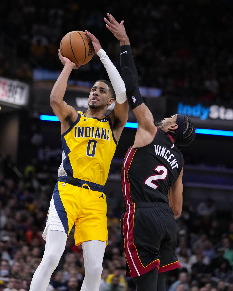 Indiana Pacers guard Tyrese Haliburton (0) shoots over Miami Heat guard Gabe Vincent (2) during the second half of an NBA basketball game in Indianapolis, Friday, Nov. 4, 2022. The Pacers defeated the Heat 101-99. (AP Photo/Michael Conroy)