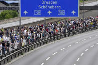FILE - Thousands of cyclists take part in the annual bicycle rally on the closed A100 highway, calling for more space for cyclists in Berlin, Germany, Sunday, June 12, 2022. Back in 1998, 10% of trips in Berlin were by bicycle — a share many cities can only dream about even now. By 2018, that had grown to 18%. That's in part because of Berlin’s configuration as a city of many neighborhood centers, with more people living close to where they work and shop. Cycling jumped 22% in 2020, then declined in 2021 but was still 14% higher than in 2019. (AP Photo/Michael Sohn, File)