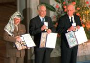 Shimon Peres (C) was jointly awarded the 1994 Nobel Peace Prize with Yasser Arafat (L) and Yitzhak Rabin (R) for their efforts to reach a peace deal between Israel and the Palestinian Liberation Organisation