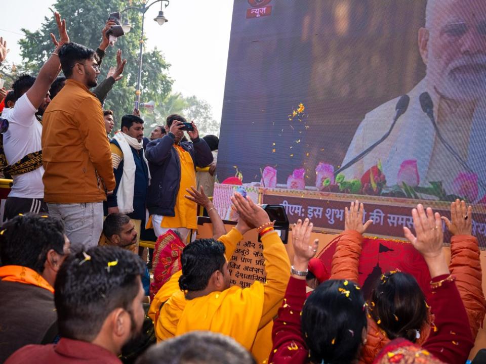 Devotees cheer, worship and prostrate before one of the many live telecasts in Ayodhya of the Ram temple consecration ceremony. The same telecast was shown at Times Square in New York and other parts of the world.<span class="copyright">Mahesh Shantaram for TIME</span>