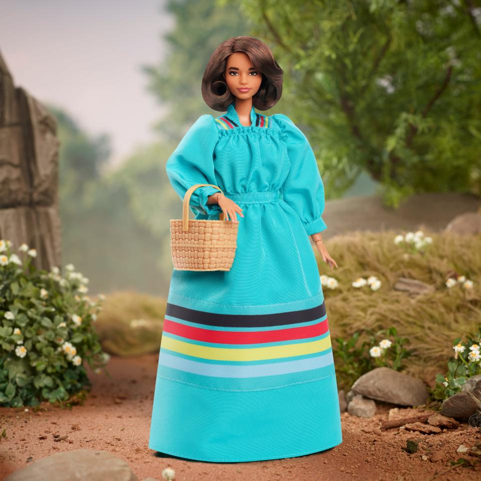 Barbie is recognizing Wilma Mankiller as the newest addition to the Barbie Inspiring Women series. The doll wears a richly pigmented turquoise dress with ribbon striping that represents the four directions: north, south, east and west.