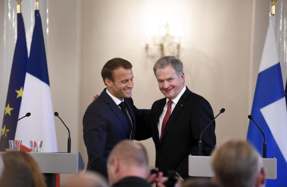 French President Emmanuel Macron, left, and Finland President Sauli Niinisto after their joint press conference Presidential Palace in Helsinki, Finland, Thursday Aug. 30, 2018. President Macron is in Finland on a two-day official visit. (Antti Aimo-Koivisto/Lehtikuva via AP)