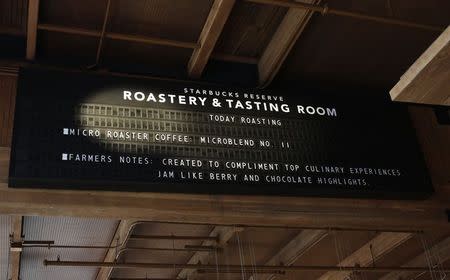 A sign announces the day's roasts as Starbucks previews its new Reserve Roastery and Tasting Room in conjunction with its biennial investor meeting in Seattle, Washington December 4, 2014. REUTERS/Jason Redmond