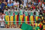 <p>Senegalese fans with painted faces spell out the name Senegal during a First Stage Group H football match between Poland and Senegal at Spartak Stadium at FIFA World Cup Russia 2018. Sergei Bobylev/TASS (Photo by Sergei Bobylev\TASS via Getty Images) </p>