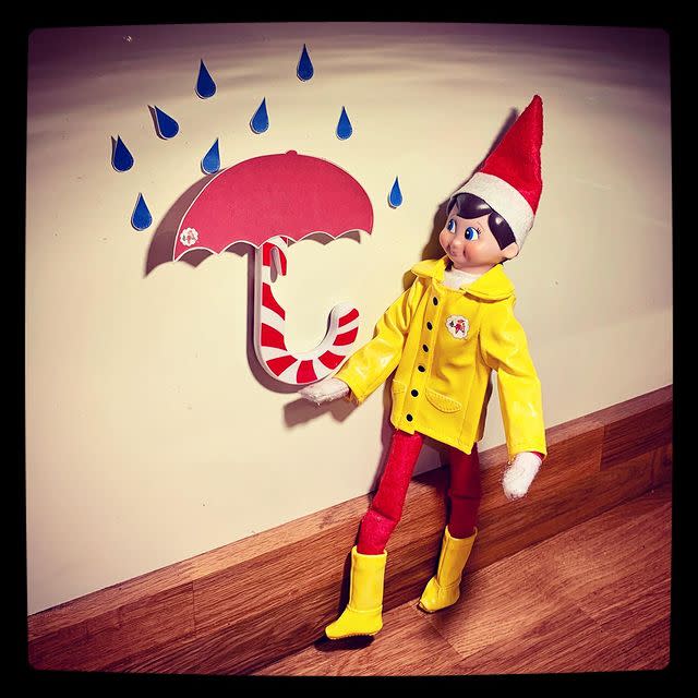 22) Elf on the Shelf wearing a raincoat