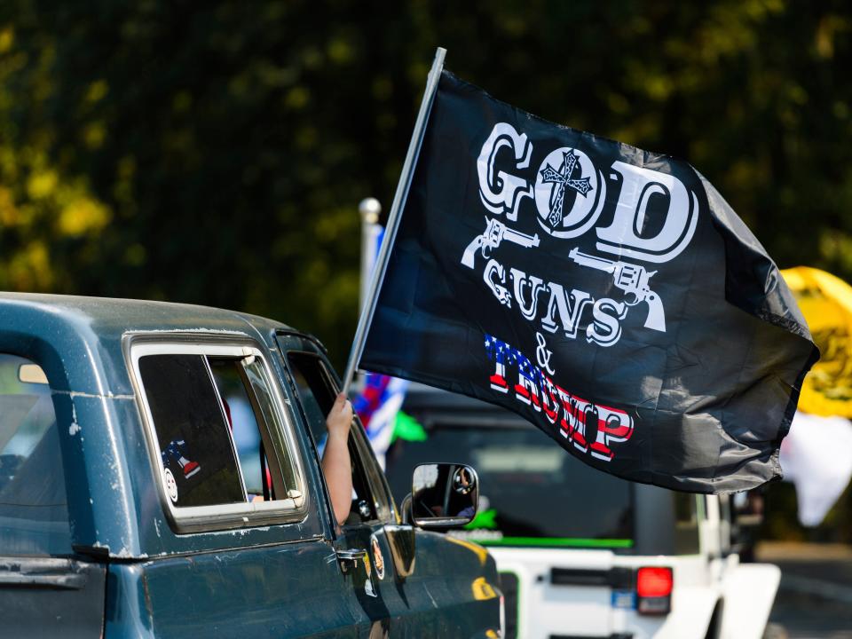 This Sept. 7, 2020 file photo shows the "Oregon for Trump 2020 Labor Day Cruise Rally" at Clackamas Community College in Oregon City, Ore.