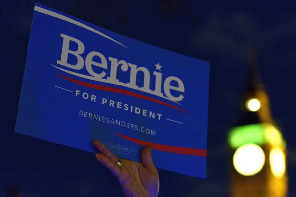 LONDON, ENGLAND - MARCH 01:  A supporter of American Democrat candidate Bernie Sanders waves a sign with the slogan 'Bernie For President' during a Super Tuesday rally in Parliament Square on March 1, 2016 in London, England. Super Tuesday is a day in the United States presidential primary season where a large number of states hold their primary elections. American citizens abroad are allowed to vote for their chosen candidate at local polling centres. (Photo by Ben Pruchnie/Getty Images)