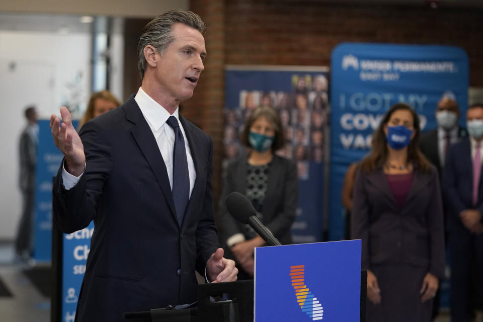 FILE — In this July 26, 2021 file photo Gov. Gavin Newsom speaks at a news conference in Oakland, Calif. Conservative radio talk show host Larry Elder has emerged as the top contender for those who are looking to unseat Newsom in the Sept. 14th recall election. Elder, who is running to replace Newsom in the Sept. 14 recall election, says he would erase state vaccine and mask mandates, is critical of gun control, opposes the minimum wage and disputes the notion of systemic racism in America. (AP Photo/Jeff Chiu, File)