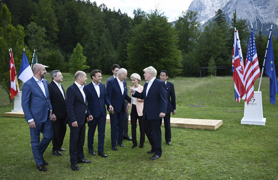 Britain's Prime Minister Boris Johnson, second right, speaks with from left, European Council President Charles Michel, Italy's Prime Minister Mario Draghi, Germany's Chancellor Olaf Scholz, France's President Emmanuel Macron, US President Joe Biden, European Commission President Ursula von der Leyen and Canada's Prime Minister Justin Trudeau and Japan's Prime Minister Fumio Kishida as they leave after posing for a group photo , during the G7 Summit, at Castle Elmau in Kruen, near Garmisch-Partenkirchen, Germany, Sunday, June 26, 2022. The Group of Seven leading economic powers are meeting in Germany for their annual gathering Sunday through Tuesday. (Brendan Smialowski/Pool via AP)