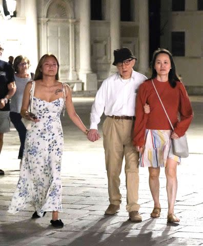 <p>Cobra Team / BACKGRID</p> Bechet Allen (left), Woody Allen and Soon-Yi Previn (right) in Venice, Italy on Sept. 5, 2023