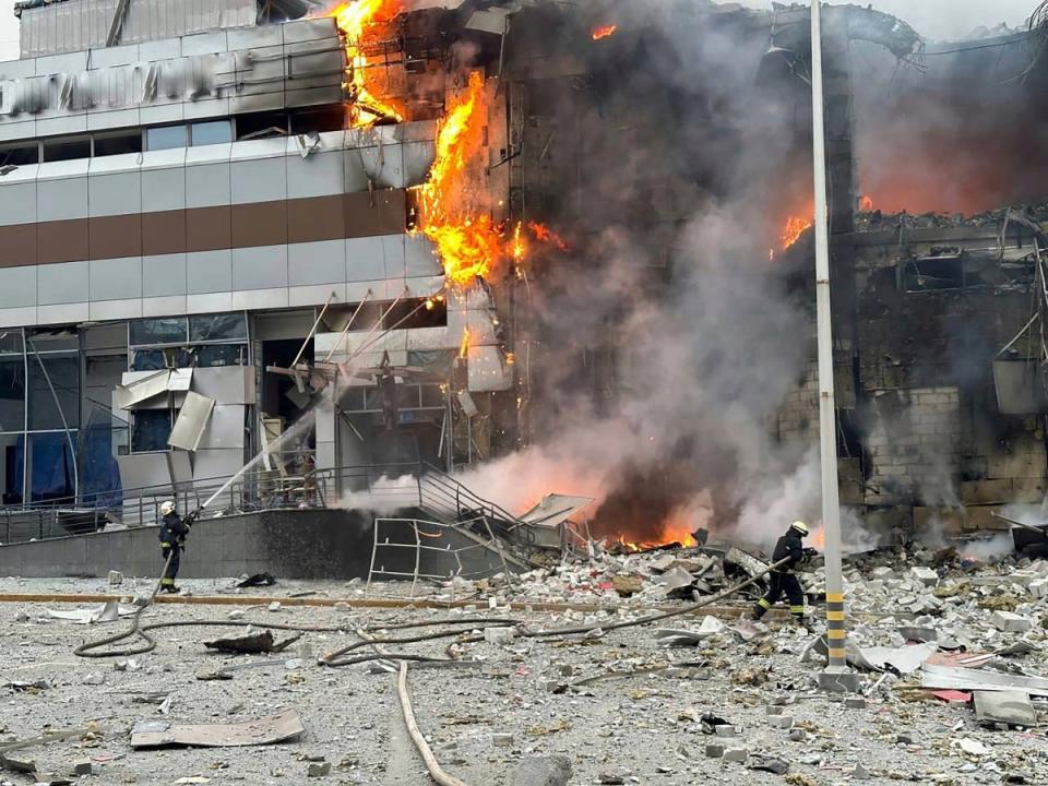 Firefighters work on a site of a building damaged after a Russian attack in Kyiv, Ukraine (AP)