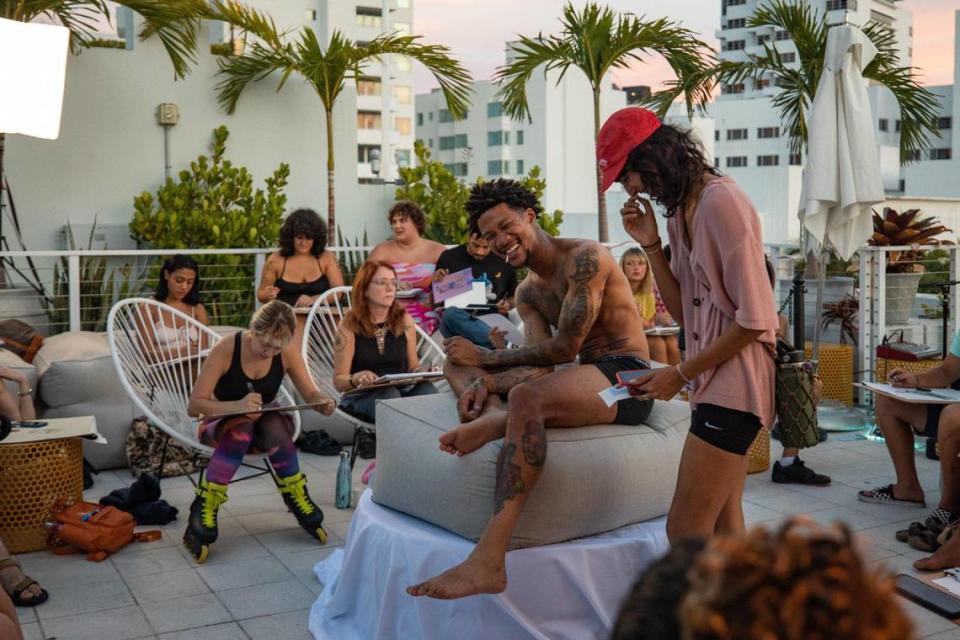 Artist Mychal Clayton (left) laughs with founder of Raw Figs Vida Sofia at Hotel Greystone during the Raw Figs Pop Up in Miami Beach, Florida on Wednesday, August 25, 2022.
