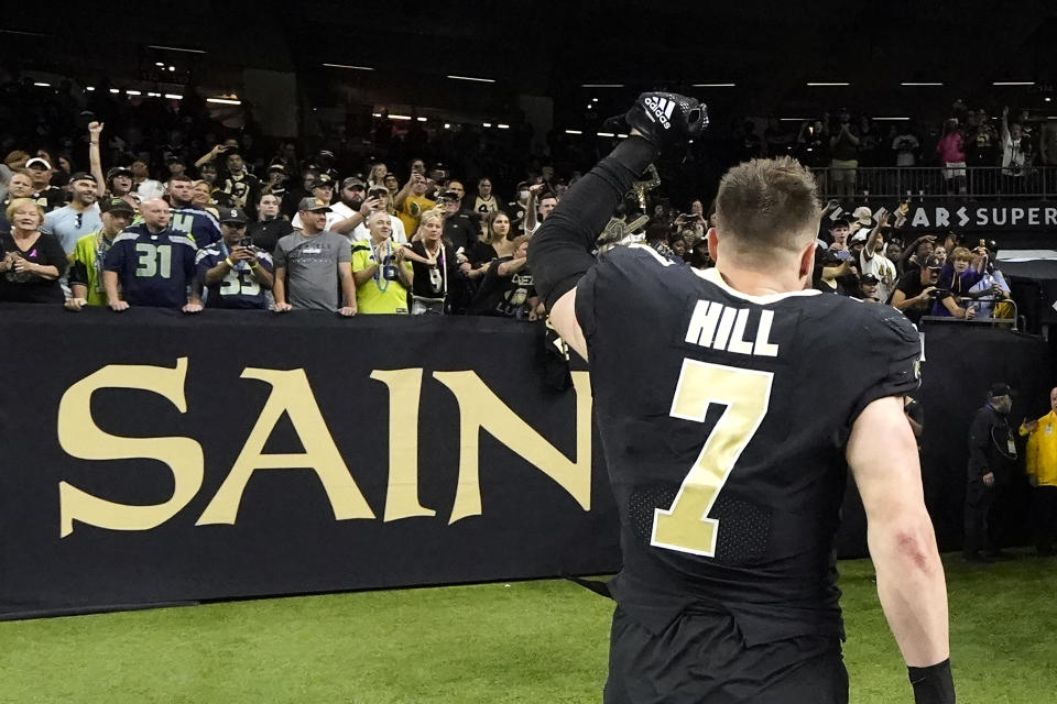 New Orleans Saints' Taysom Hill acknowledges the fans as he leaves the field after the team's 39-32 win over the Seattle Seahawks after an NFL football game in New Orleans, Sunday, Oct. 9, 2022. (AP Photo/Gerald Herbert)