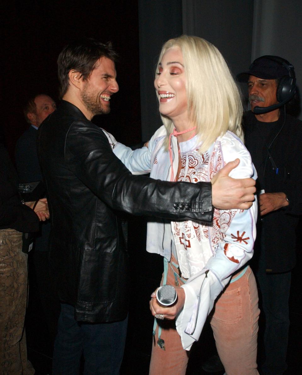 Cher and Tom Cruise backstage hugging