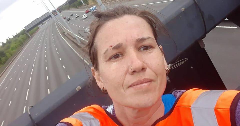 One of the activists who has climbed motorway signs on the M25 (Just Stop Oil/PA) (PA Media)