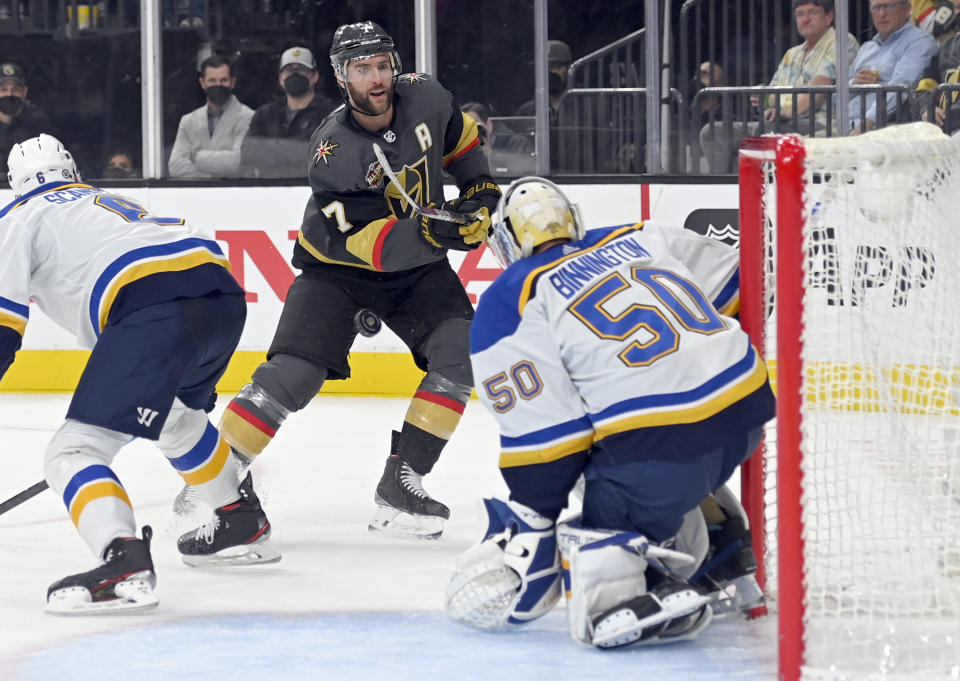 Vegas Golden Knights defenseman Alex Pietrangelo (7) shoots on St. Louis Blues goaltender Jordan Binnington (50) during the second period of an NHL hockey game Wednesday, Oct. 20, 2021, in Las Vegas. (AP Photo/David Becker)