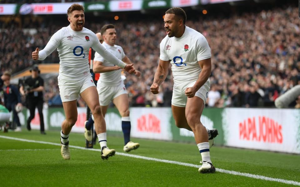 Ollie Lawrence celebrates scoring a try against Ireland