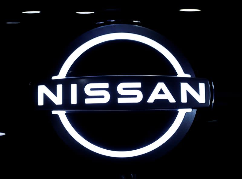 FILE PHOTO: The brand logo of Nissan Motor Corp. is seen at the front nose section of the company's new Ariya all-battery SUV during a press preview in Yokohama