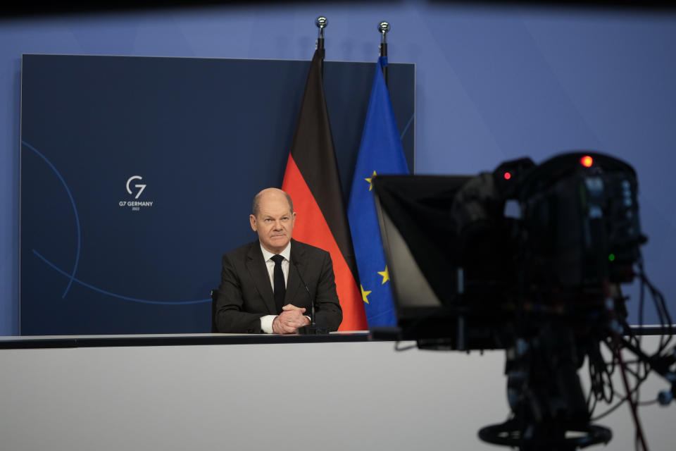 German Chancellor Olaf Scholz sits in front of a camera prior to his speech for the Davos Agenda 2022, at the chancellery in Berlin, Germany, Wednesday, Jan. 19, 2022. The Davos Agenda, which takes place from Jan. 17 to Jan. 21, 2022, is an online edition of the annual Davos meeting of the World Economy Forum due to the coronavirus pandemic. (AP Photo/Markus Schreiber, Pool)