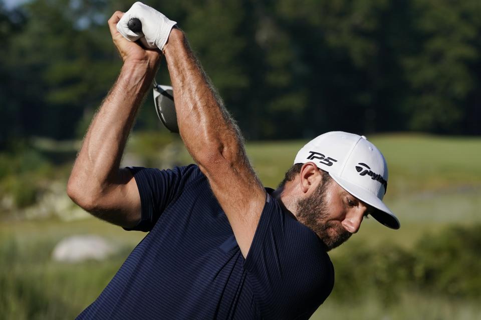 Dustin Johnson tees off on the 13th hole during the final round of the Northern Trust golf tournament at TPC Boston, Sunday, Aug. 23, 2020, in Norton, Mass. (AP Photo/Charles Krupa)