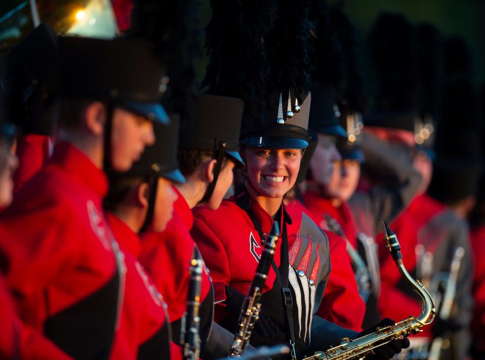 Members of Crestwood's band prepare to perform at halftime of last Friday's game at Rootstown.