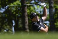 Patrick Reed reacts to his tee shot on the fourth hole during final round at the Masters golf tournament at Augusta National Golf Club Sunday, April 14, 2024, in Augusta, Ga. (AP Photo/Ashley Landis)