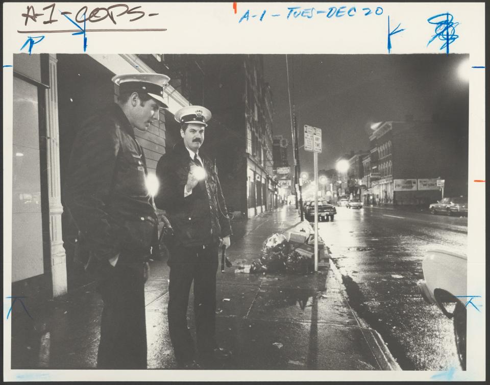 A Dec. 20, 1983, photo from The Cincinnati Enquirer Photo Archive in the public library’s Digital Library. The original caption: “POLICE OFFICERS and partners John Sess, left, and Randy Adams, stand out on any street – especially the streets of Over-the-Rhine.”