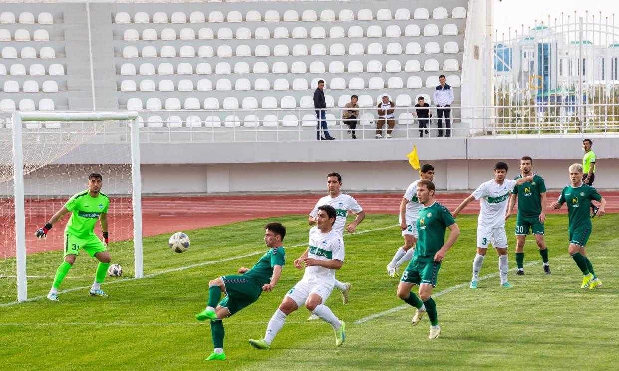 <span>Arkadag (in white) defeated Ahal 4-1 in Turkmenistan on 30 March. The champions have won six league games from six this season.</span><span>Photograph: AFP/Getty Images</span>