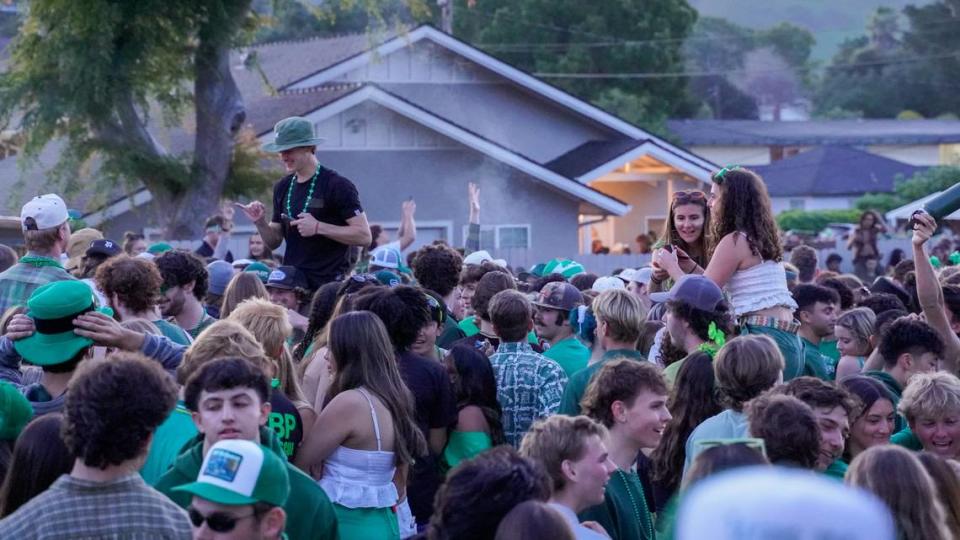 Cal Poly students turned out early Saturday morning, March 16, 2024, for St. Fratty’s Day festivities on Hathway Avenue near the university. A San Luis Obispo Police Department officer at the scene estimated between 6,000 and 7,000 people in attendance. John Lynch/jlynch@thetribunenews.com