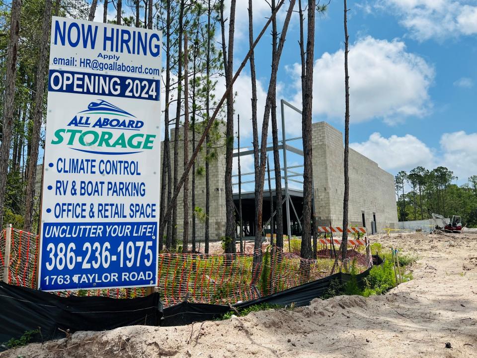 A hiring sign can be seen in front of the All Aboard Storage center under construction at 1763 Taylor Road in Port Orange on Saturday, May 20, 2023.