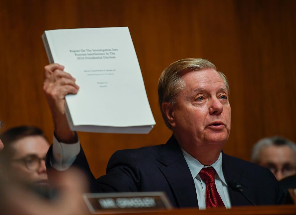 5/1/19 10:03:34 AM -- Washington, DC, U.S.A  -- Senate Judiciary Committee Chairman Lindsey Graham holds the Mueller Report during opening statements before Attorney General William Barr would testify before the House Judiciary Committee hearing about special counsel Robert Mueller’s report and his handling of the investigation. --    Photo by Jack Gruber, USA TODAY staff ORG XMIT:  JG 137975 Bill Barr is on  5/1/ (Via OlyDrop)