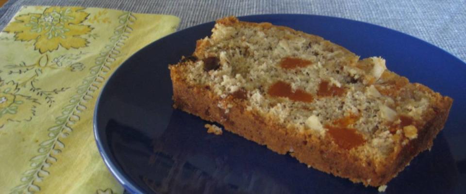 Slice of fruitcake on a blue plate