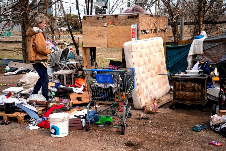 Jeff D. returns to his homeless camp after receiving supplies on Monday, March 6, 2023, during a Mental Health Association of Oklahoma homeless outreach stop in Oklahoma City.