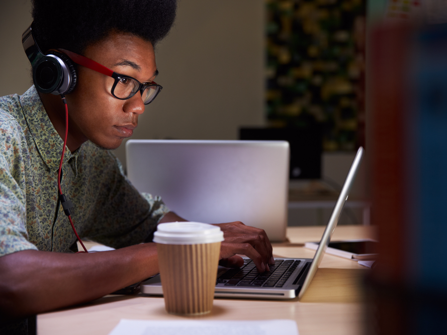 office desk laptop headphones coffee employee working