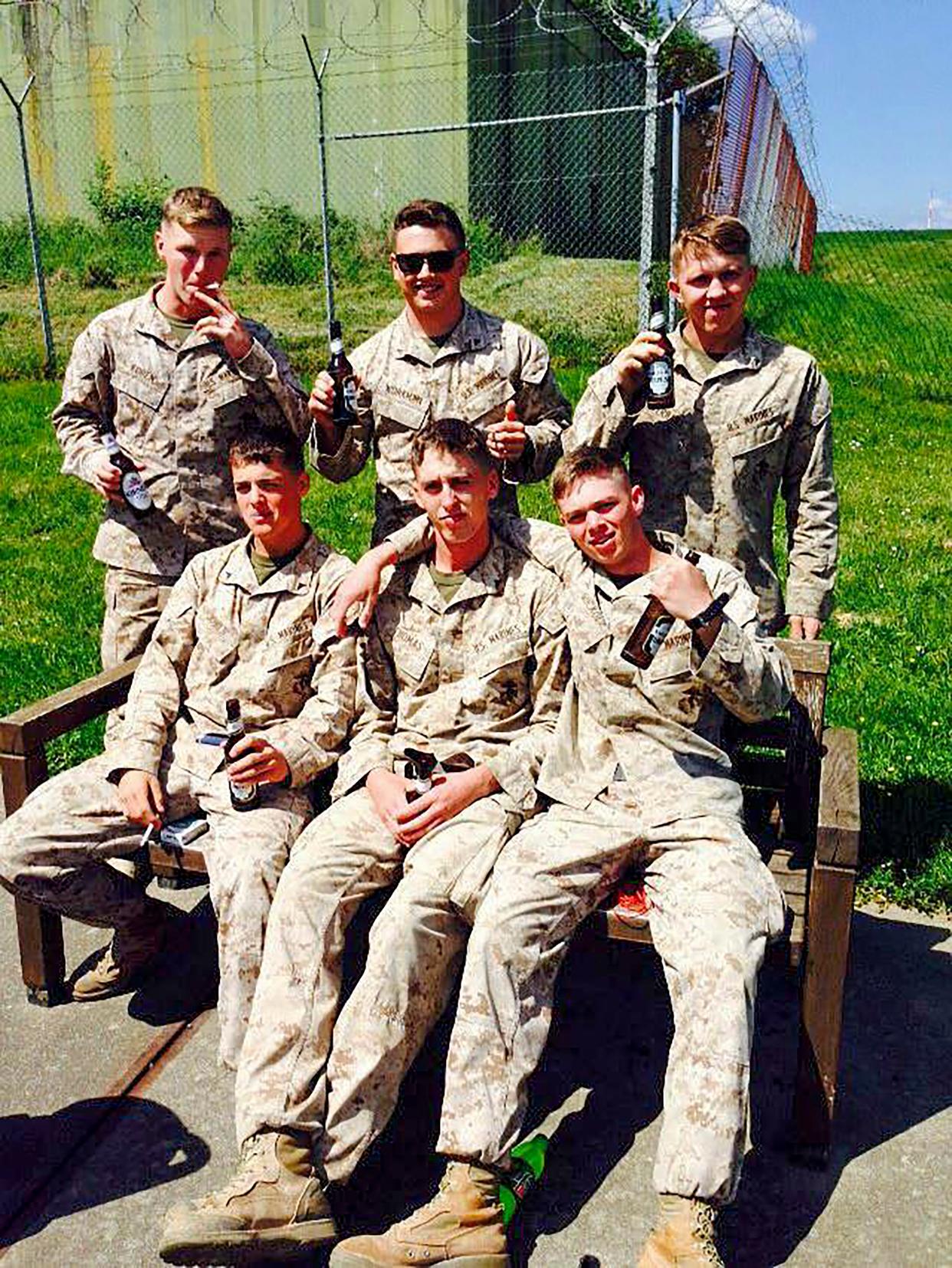 Rowan Sockol (bottom right) with fellow marines after just arriving to Germany from Afghanistan.