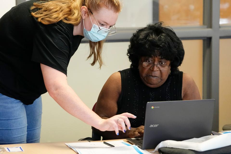 Gail McDonald of Driving Park receives assistance from Kara Shamblin during the Technology Access Project class for seniors at the Central Community House on the Near East Side on June 30.