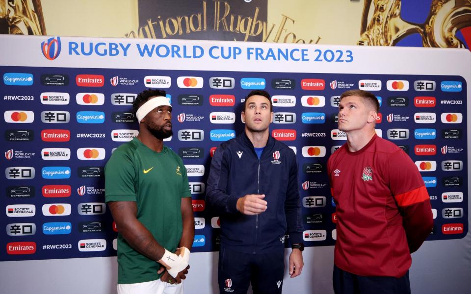 Captains Owen Farrell (right) and Siya Kolisi take part in the coin toss