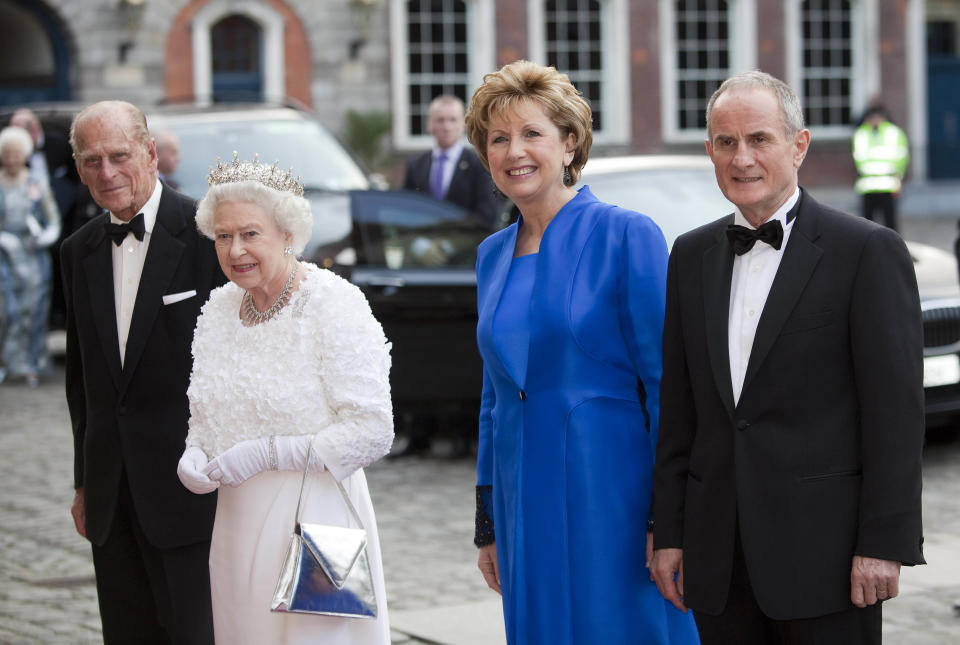 DUBLIN, IRELAND - MAY 18:  (NO UK SALES FOR 28 DAYS) Irish President Mary McAleese (2nd R) and husband Martin McAleese (R) greet Queen Elizabeth II and Prince Philip, Duke of Edinburgh as they arrive for a State Dinner on May 18, 2011 in Dublin, Ireland. The Duke and Queen&#39;s visit to Ireland is the first by a monarch since 1911. (Photo by Samir Hussein/WireImage)