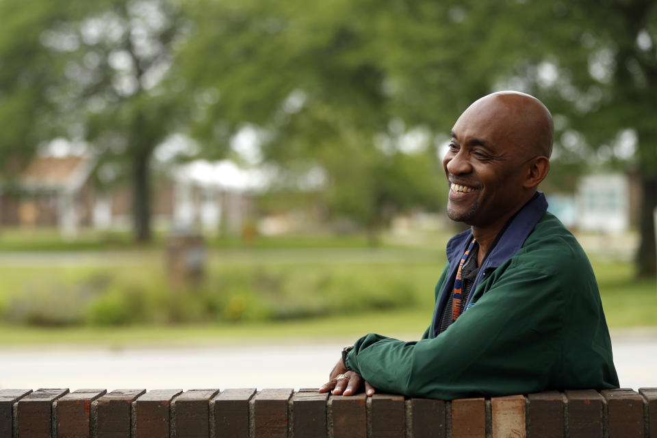 Crosby Smith, care provider at Ludeman Developmental Center, a state home for the developmentally disabled, poses for a portrait near the center premise, Thursday, July 8, 2021 in Park Forest, Ill. Smith and his fiancee were among numerous staff and residents at the Ludeman Developmental Center who contracted the virus last year. He said the hazard money helped pay down credit cards and avoid further debt when buying clothing and shoes. (AP Photo/Shafkat Anowar)