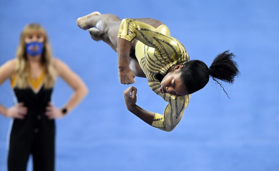 UCLA's Chae Campbell flips into the air in a straight line