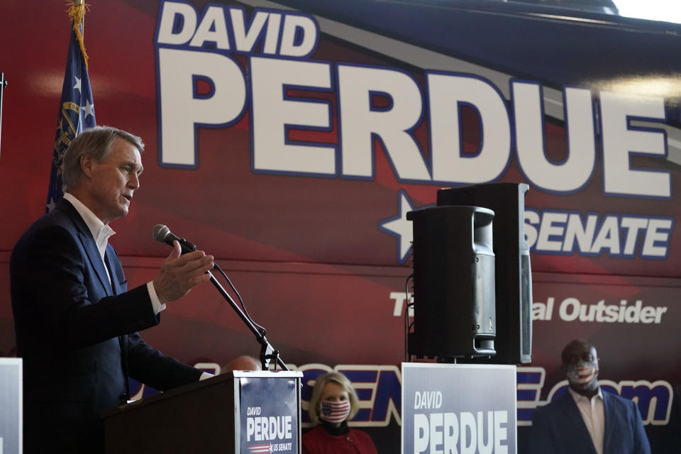 Republican candidate for Senate Sen. David Perdue speaks during a campaign stop at Peachtree Dekalb Airport Monday, Nov. 2, 2020, in Atlanta. (AP Photo/John Bazemore)