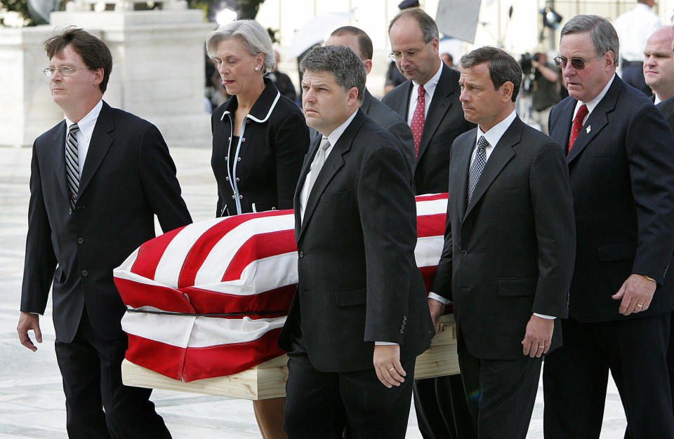 The casket of Chief Justice William Rehnquist is carried by his former court clerks up the stairs of the Supreme Court on Sept. 7, 2005. Second from right is Judge John Roberts, whom President George W. Bush nominated to replace Rehnquist.