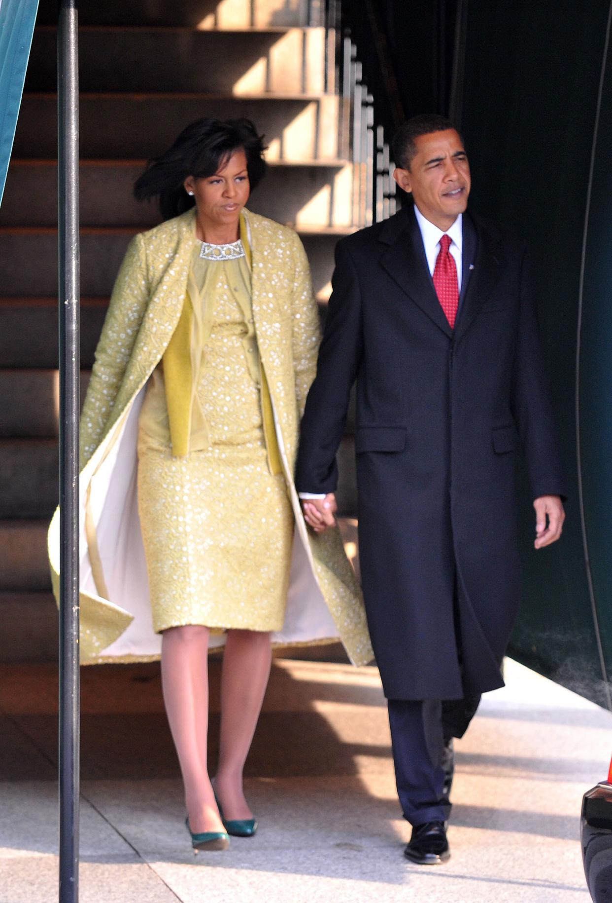 Michelle Obama and husband Barack Obama depart the Blair House in Washington en route to his 2009 inauguration. The ceremony drew an estimated 1.8 million people to the National Mall, by far the largest crowd to attend the swearing-in event.