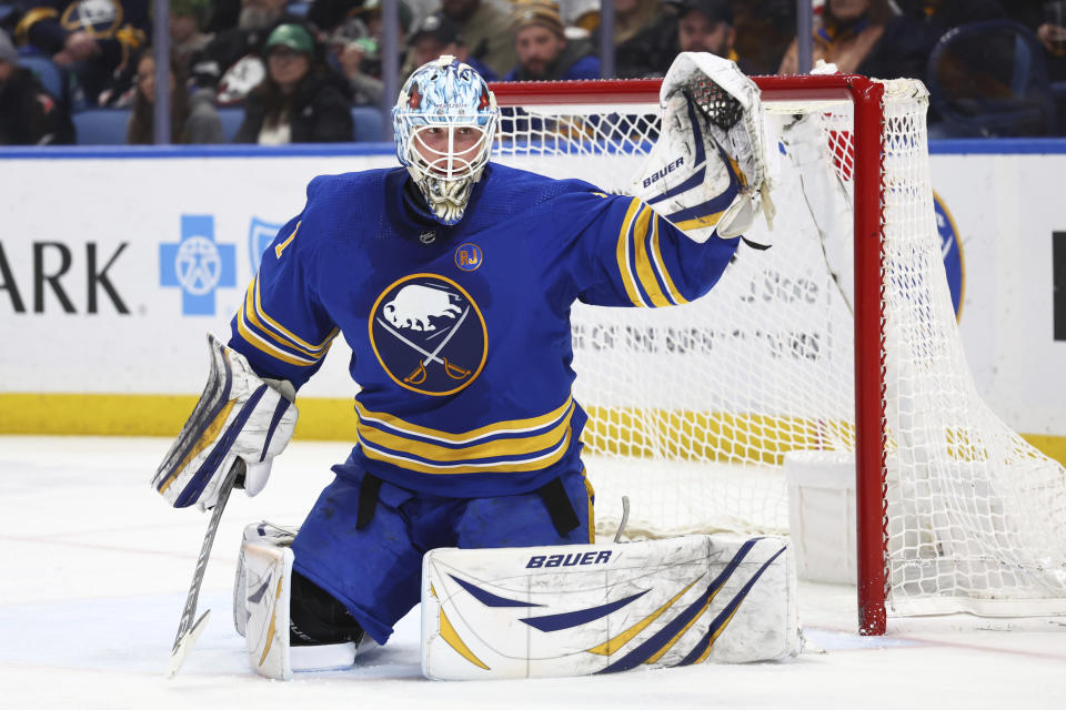 Buffalo Sabres goaltender Ukko-Pekka Luukkonen (1) reaches for the puck during the second period of an NHL hockey game again the St. Louis Blues, Saturday, Feb. 10, 2024, in Buffalo, N.Y. (AP Photo/Jeffrey T. Barnes)