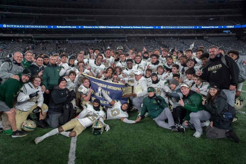 Red Bank Catholic's players and coaching celebrate on the field after winning the NJSIAA Nonpublic B championship with a 13-8 win over DePaul Friday night at MetLife Stadium.