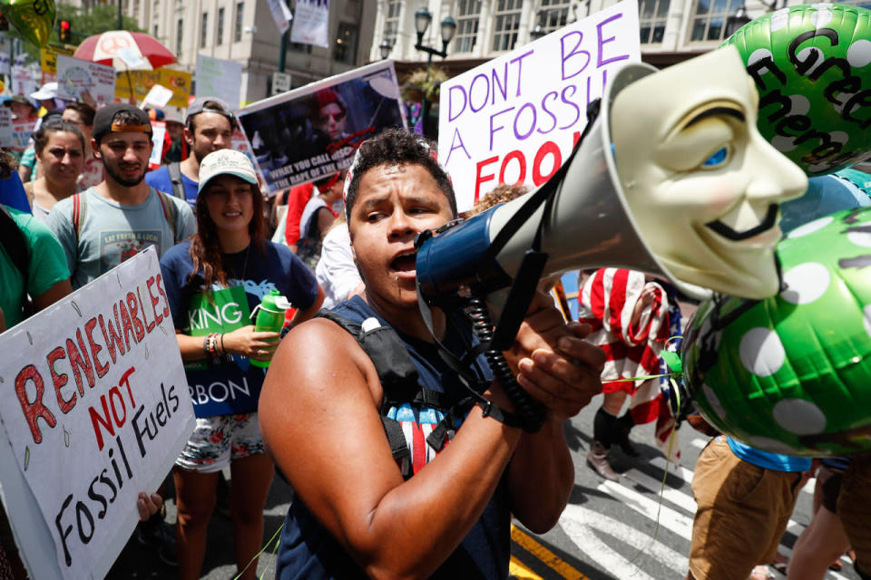 <p>A protestor chants through a megaphone as he marches during a demonstration in downtown on Sunday, July 24, 2016, in Philadelphia. The Democratic National Convention starts Monday. (AP Photo/John Minchillo)</p>