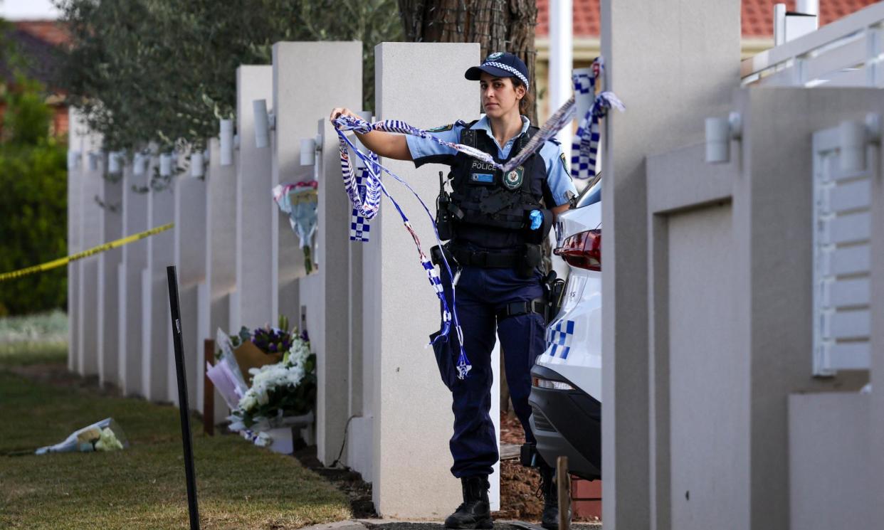 <span>A police officer at the Christ the Good Shepherd church in Sydney's western suburb of Wakeley.</span><span>Photograph: David Gray/AFP/Getty Images</span>