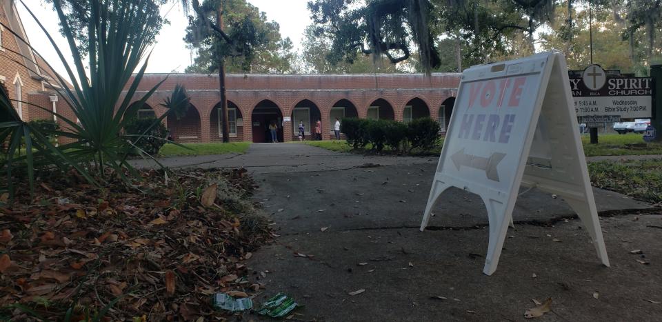 Voters line up outside Holy Spirit Lutheran Church (Precinct 2-05) on Election Day on Tuesday morning.